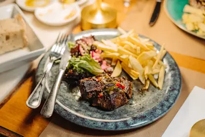 A plate of meat and potatoes at a fado show in Lisbon.